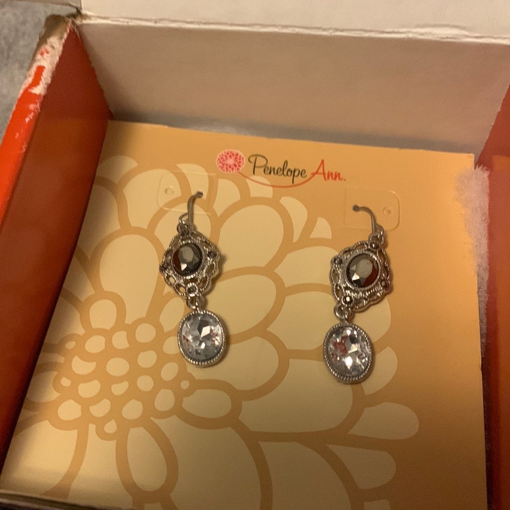 Now in box Penelope Ann earrings with gold backs with diamond and ruby earring